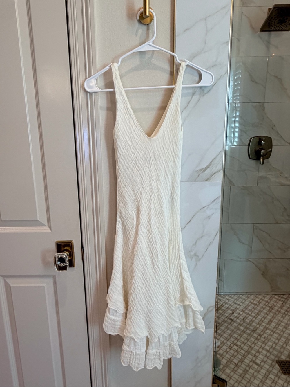 Sleeveless Cream V-Neck Midi Dress with Ruffle Hem